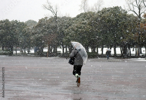 woman walking in the rain