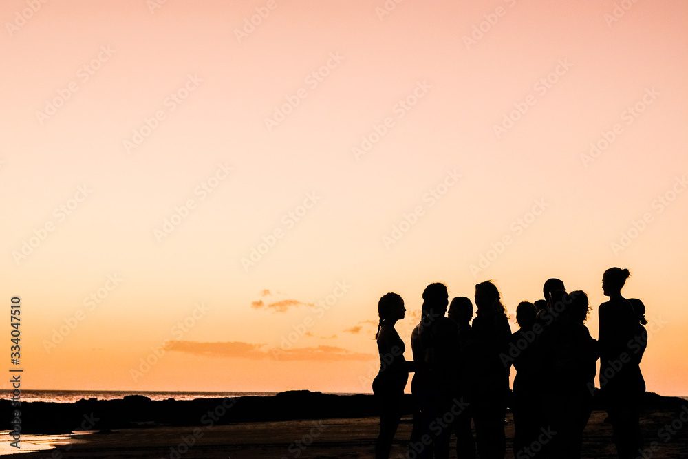 silhouette of people on beach