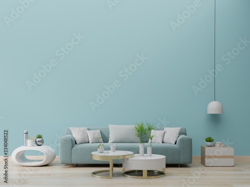 Modern living room interior with sofa and green plants lamp table on green wall background.