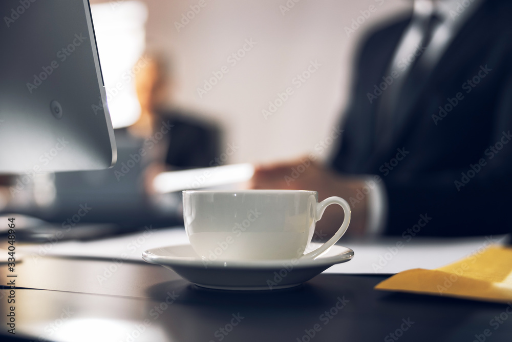 Cropped photo of cup with warm beverage on table Cropped photo of cup with warm beverage on table