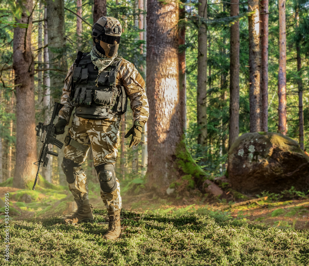 Soldier posing in forest.