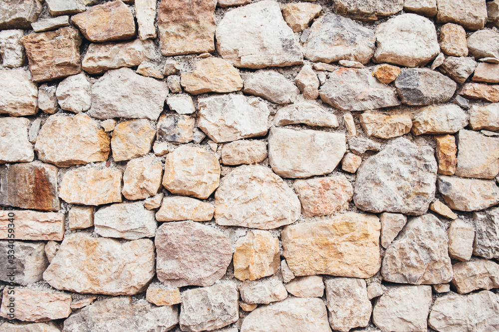 Wall of large natural stones, natural background. Great for design and texture background. Wall of large natural stones, natural background. Great for design and texture background.