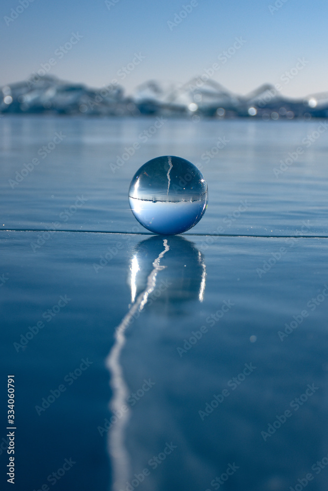 Crystal ball on ice Lake Baikal Siberia Crystal ball on ice Lake Baikal Siberia