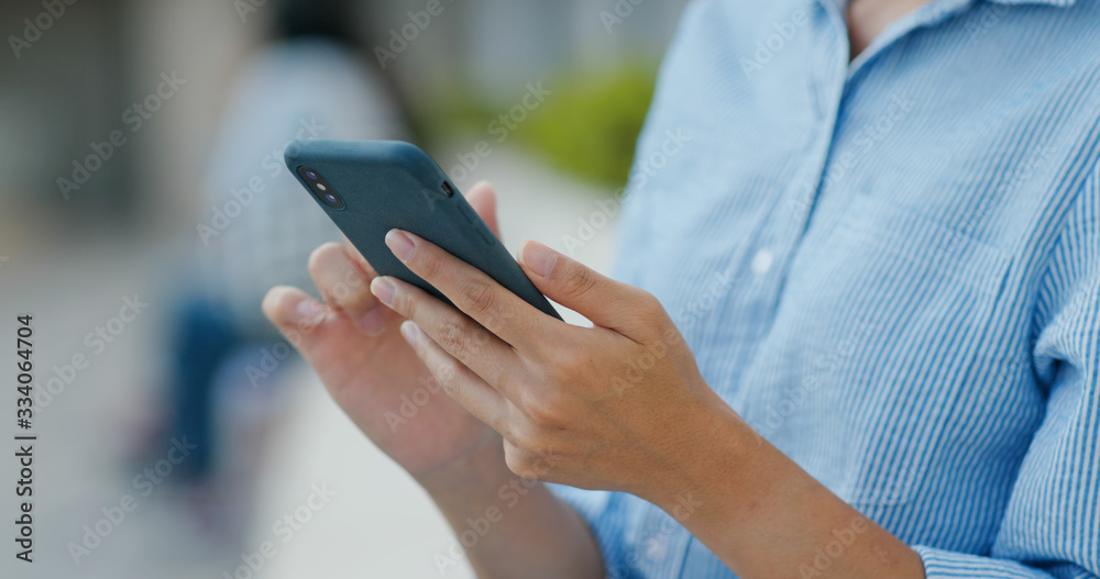 Woman use of mobile phone at outdoor