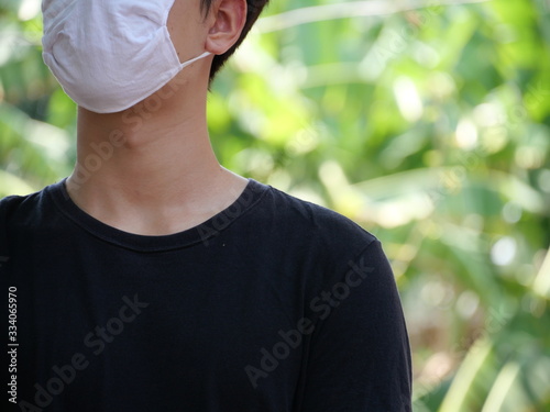 A man with his mask for protection.