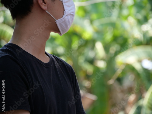 A man with his mask for protection.