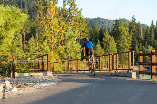 Bicyclist on walking path recreational area near Lake Tahoe