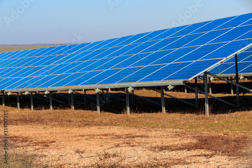Rows of solar panels in solar power plant. Photovoltaic modules for innovation alternative energy