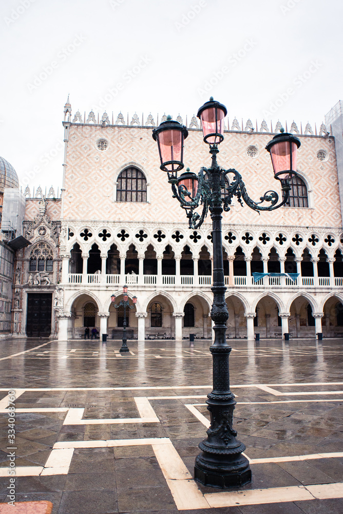 Obraz premium Old Street Lantern in Venice on San Marco Square. Early Rainy Morning. Cloudy Sky.