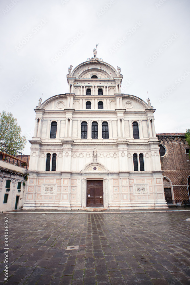 Facade of the Church San Zaccaria in Venice. Italy. Cloudy Sky. Rainy Weather.