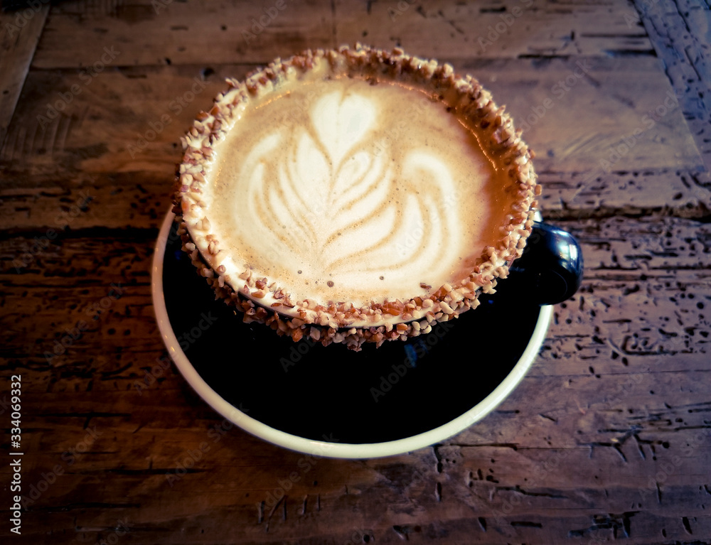 Almond coffee on a wooden table Almond coffee on a wooden table