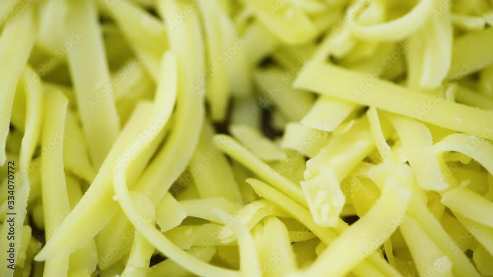 Portion of grated Cheese (seamless loopable; 4K) Portion of grated Cheese (seamless loopable; 4K)
