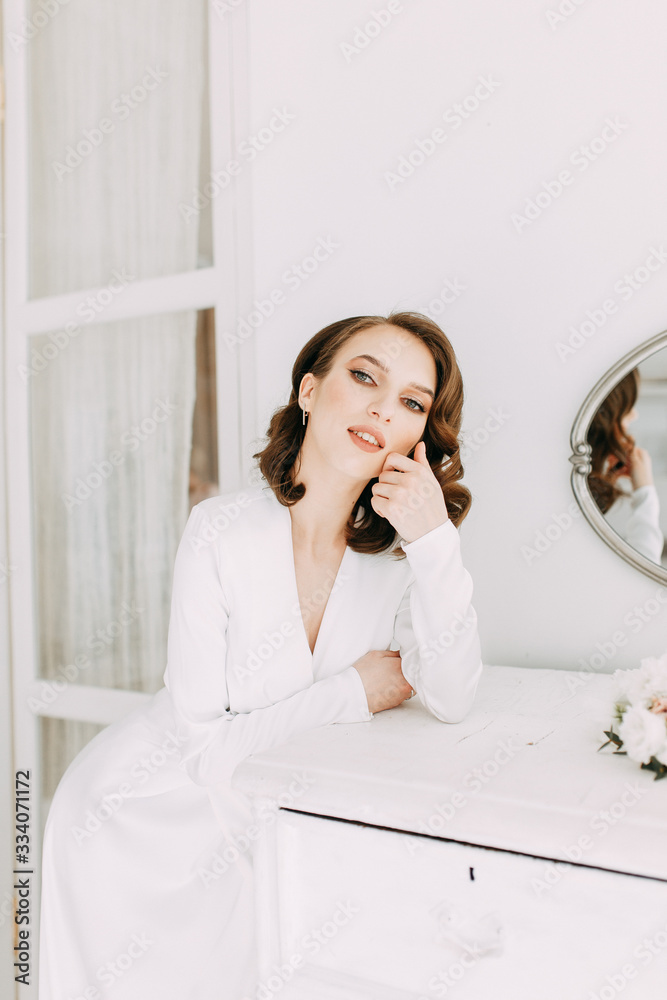 Stylish European wedding. Modern trends in the image of the bride. Bright portrait of the bride in the interior Studio. Stylish European wedding. Modern trends in the image of the bride. Bright portrait of the bride in the interior Studio.