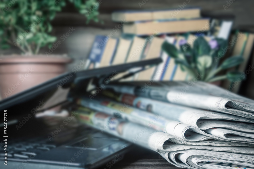 Media concept. Newspapers on the coffee table.