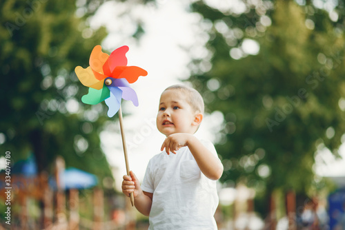 Child in a summer park. Boy on a playground.