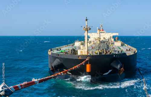 The oil tanker transfers oil in the high sea
