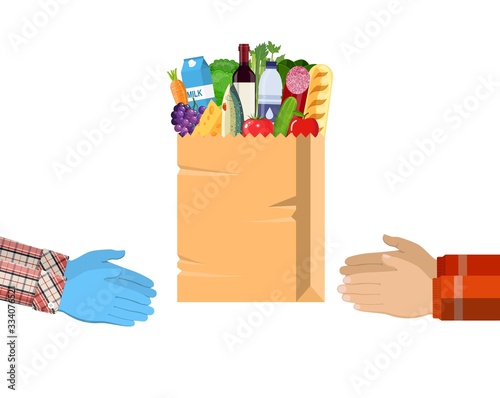 Safe contactless delivery of goods to buyer. Hands hold paper shopping bag full of groceries products with rubber gloves. Courier gives food package to client. Vector illustration in flat style