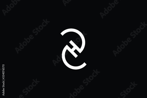 Minimal elegant monogram art logo. Outstanding professional trendy awesome artistic ZH HZ initial based Alphabet icon logo. Premium Business logo White color on black background