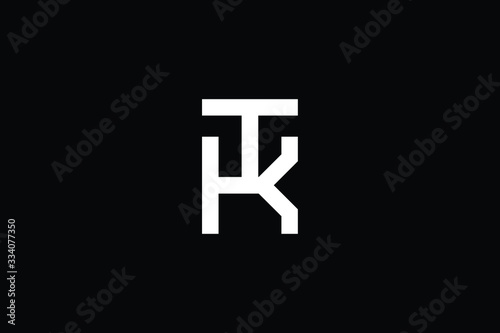 Minimal elegant monogram art logo. Outstanding professional trendy awesome artistic KT TK initial based Alphabet icon logo. Premium Business logo White color on black background