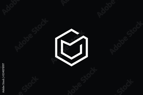Minimal elegant monogram art logo. Outstanding professional trendy awesome artistic M MU UM initial based Alphabet icon logo. Premium Business logo White color on black background