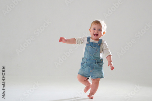 10 month old little baby learning to walk..Studio photography