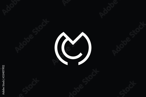 Minimal elegant monogram art logo. Outstanding professional trendy awesome artistic MC CM initial based Alphabet icon logo. Premium Business logo White color on black background