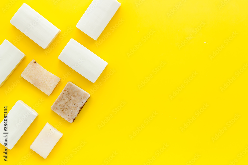 Soap bars flat lay on yellow background top-down copy space frame Soap bars flat lay on yellow background top-down copy space frame