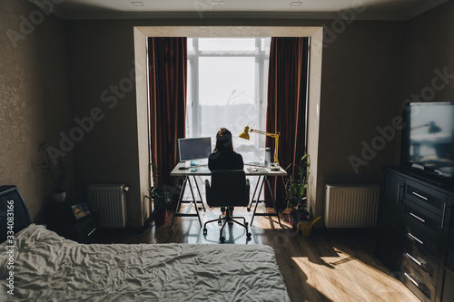 woman working on laptop at home. telework photo