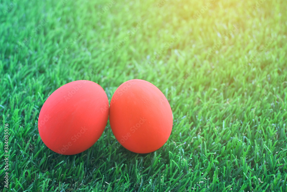 red easter egg on lawn green grass artificial, image of morning springtime concept