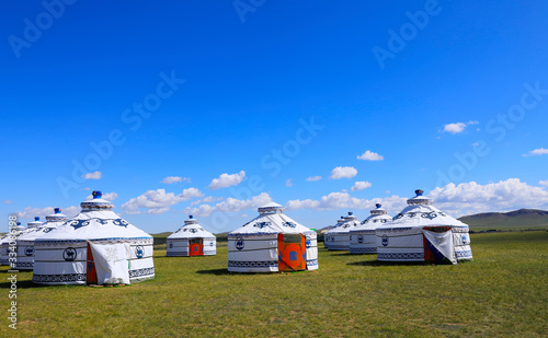 Mongolian yurt on the grassland,in the background of blue sky an © hanmaomin
