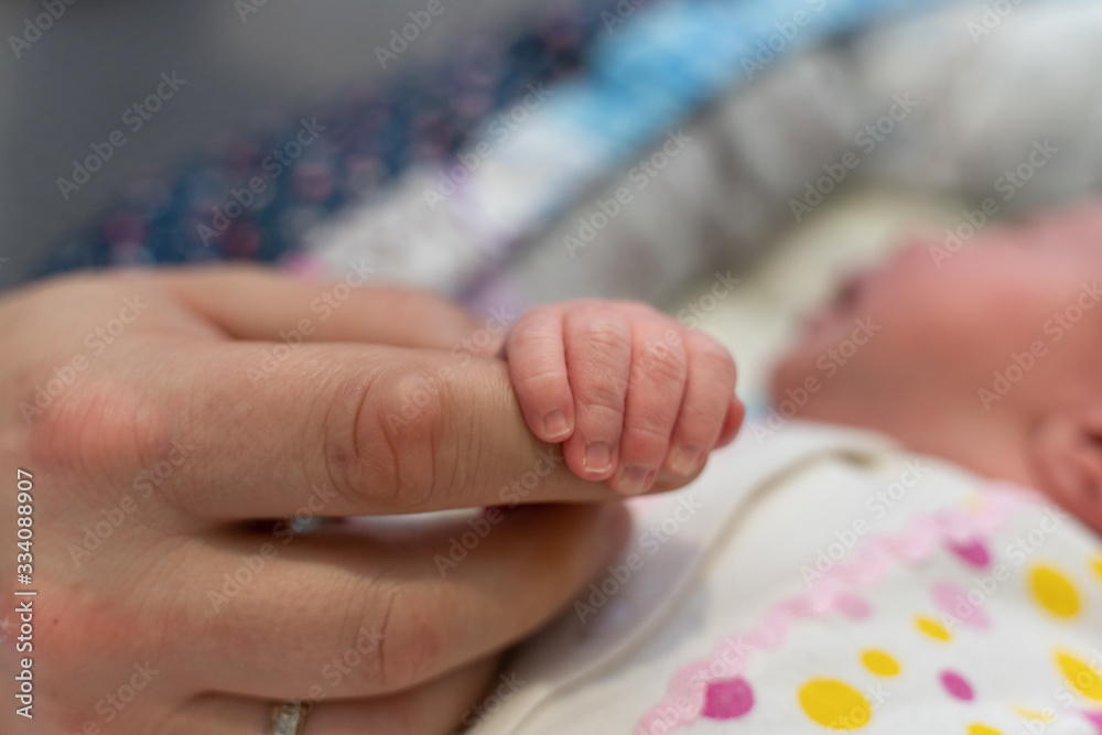 hands of a newborn baby and dad hands of a newborn baby and dad