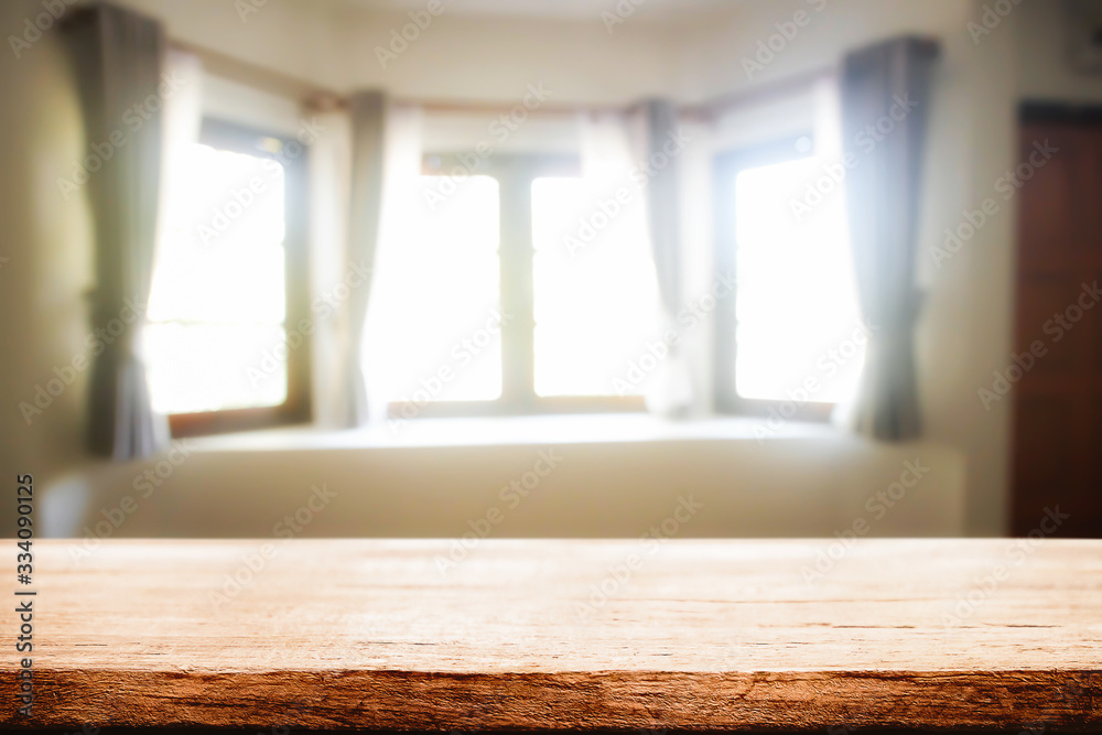 Empty wooden desk space and blurry background of home window vintage tone for product display montage Empty wooden desk space and blurry background of home window vintage tone for product display montage
