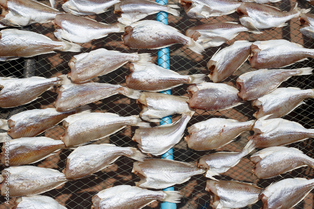Naklejka premium Top view of Dried sea fishes in Thailand