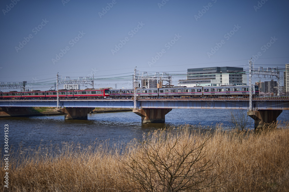 Trains passing in a bridge in Tokyo, Japan