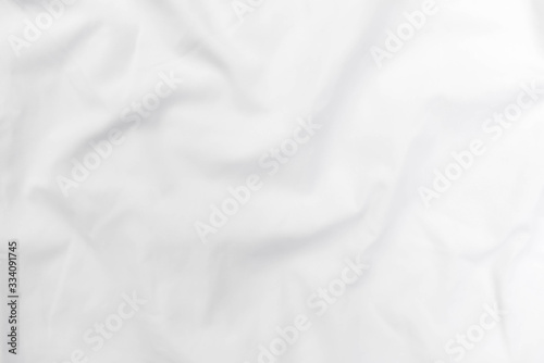 Abstract white fabric texture background. Wavy white cloth. 