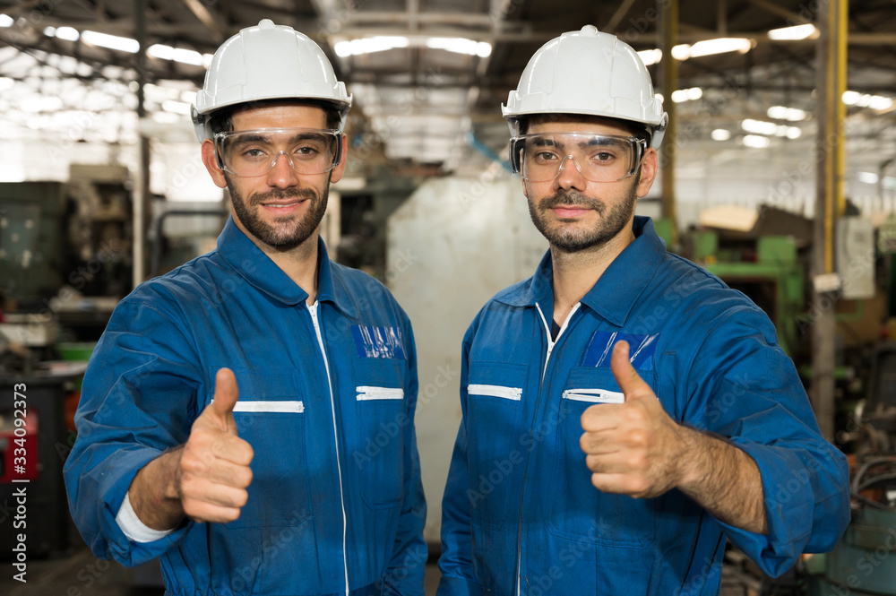 Industrial workers are working on projects in large industrial plants with many devices. Industrial workers are working on projects in large industrial plants with many devices.