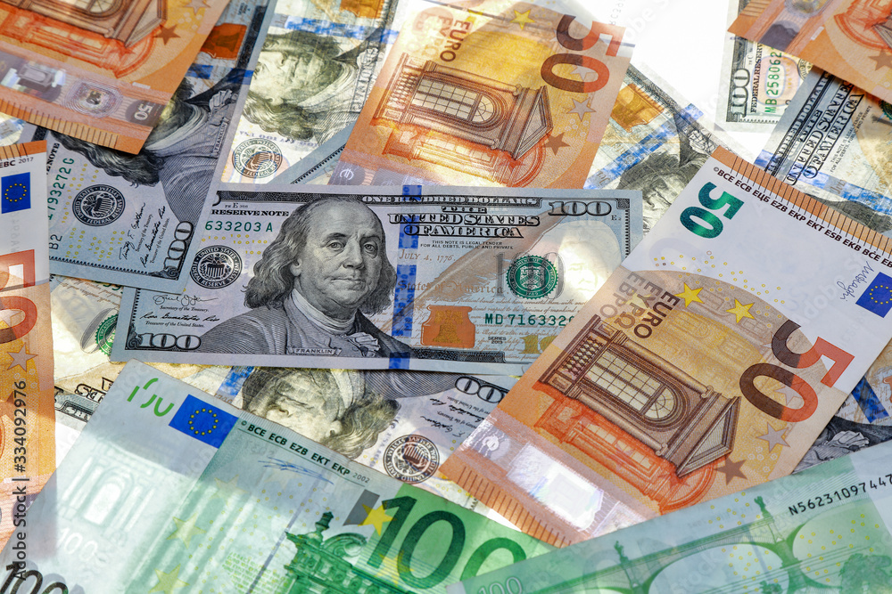 different dollar and euro bills on a white background different dollar and euro bills on a white background