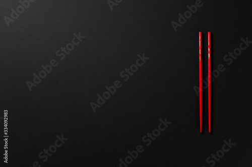 black background with red chopsticks