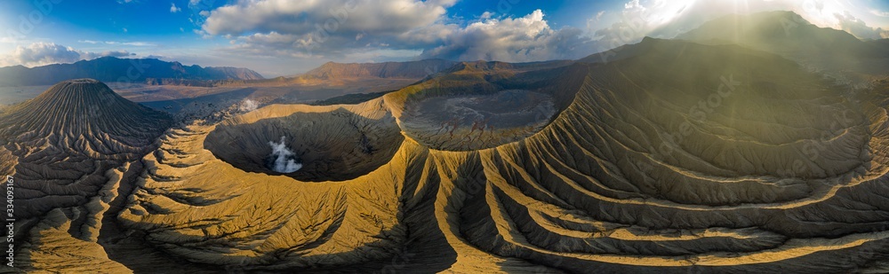 Aerial view of a spectacular volcanic landscape in golden, late evening sunlight.  (Mount Bromo)