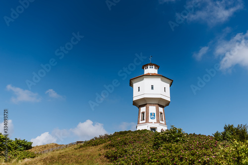Water tower of the island Langeoog, Germany, sunny day, blue sky