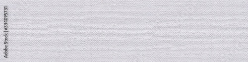 Linen canvas background in adorable white color for your creative new work. Seamless panoramic texture.
