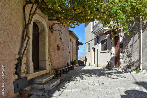 A narrow street between the old houses of Castelvetere sul Calore, village in the province of Avellino, Italy