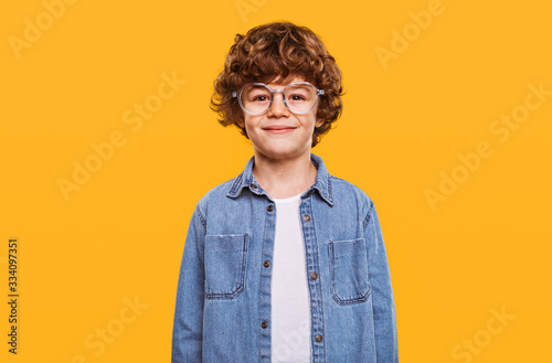 Happy smart boy in glasses photo