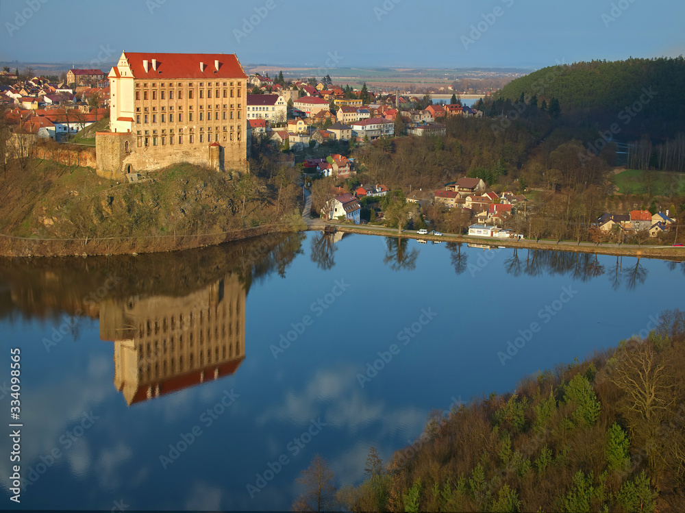 An aerial view of Plumlov Castle, reflected on the surface of Plumlov Lake, designed by Charles Eusebius of Liechtenstein. Tourist spot, Plumlov castle, central Moravia, Czech landscape