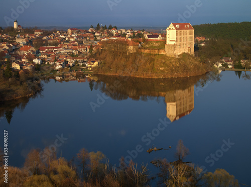 An aerial view of Plumlov Castle, reflected on the surface of Plumlov Lake, designed by Charles Eusebius of Liechtenstein. Tourist spot, Plumlov castle, central Moravia, Czech landscape photo