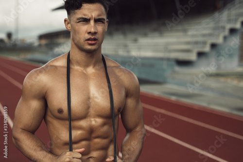 Muscular man taking rest after a fitness workout