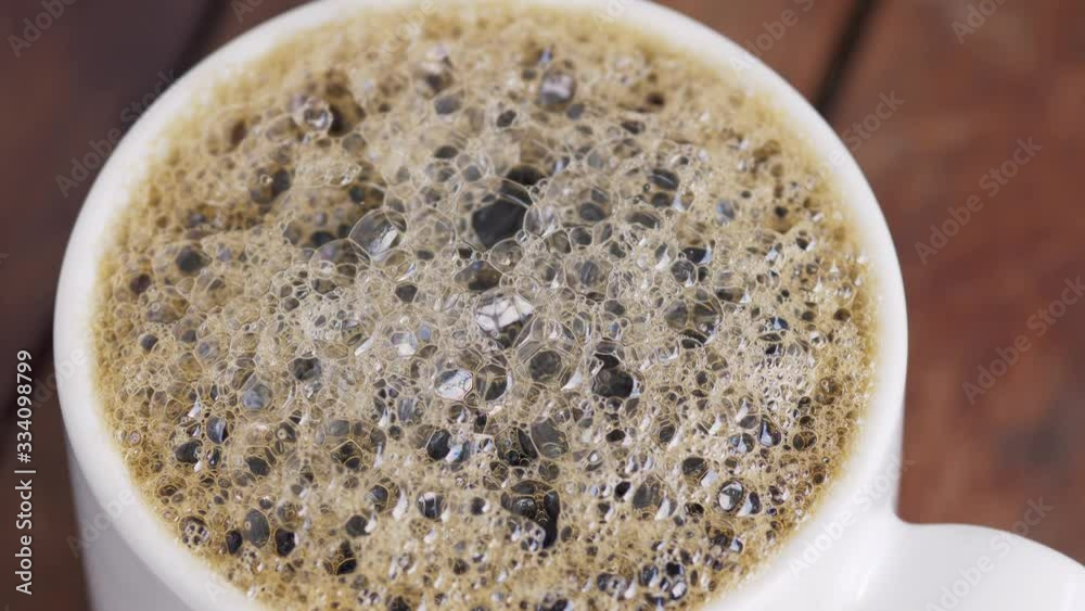 Make a cup of coffee in the morning. The foam of the coffee looks very good to drink for work at home. Make a cup of coffee in the morning. The foam of the coffee looks very good to drink for work at home.
