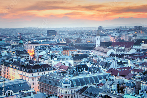 Austria, Vienna -  View from the main cathedral of St. Stephen to the city, twilight. Evening view of the city of Vienna, the lights of the night city.