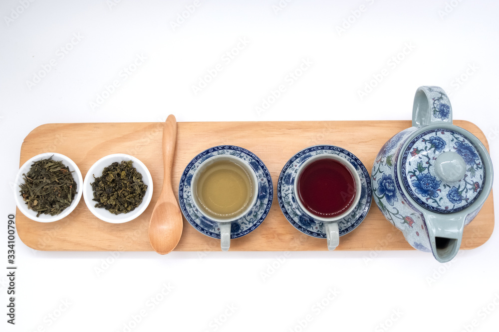 cup with tea and teapot on white background, over light cup with tea and teapot on white background, over light