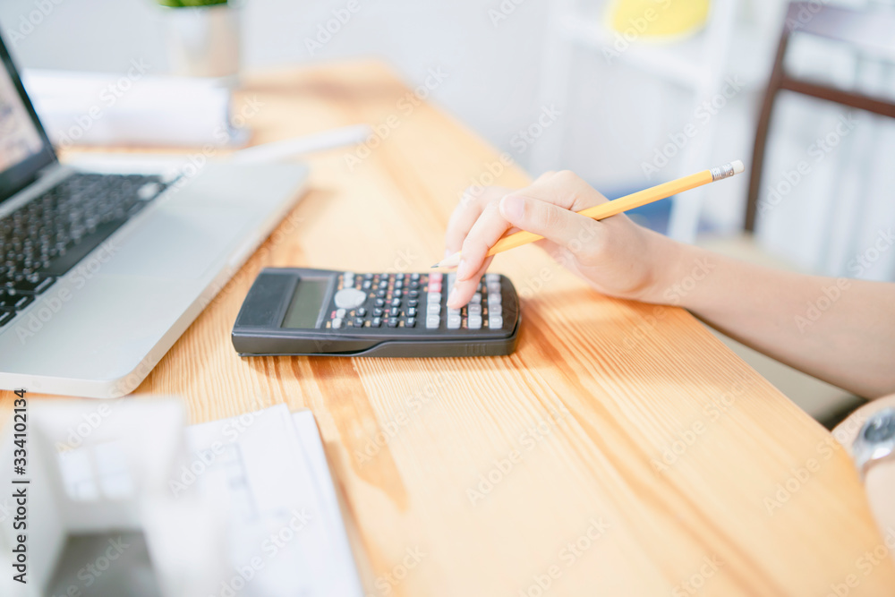 calculate,finance,account concept,Asian business woman entrepreneur Startup using calculator calculating financial expense at office,online technology packing box delivery by small business owner,SME calculate,finance,account concept,Asian business woman entrepreneur Startup using calculator calculating financial expense at office,online technology packing box delivery by small business owner,SME